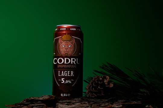 Bucharest, Romania February 2023. Codru is a Romanian beer, both lager and strong, is a beer brand with different flavors. Red background for editorial concept.