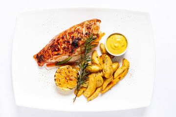 chicken with baked potato and sauce