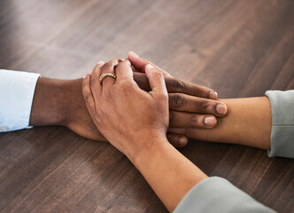 Support, help and couple holding hands for trust, empathy and unity in crisis, cancer or bad news....
