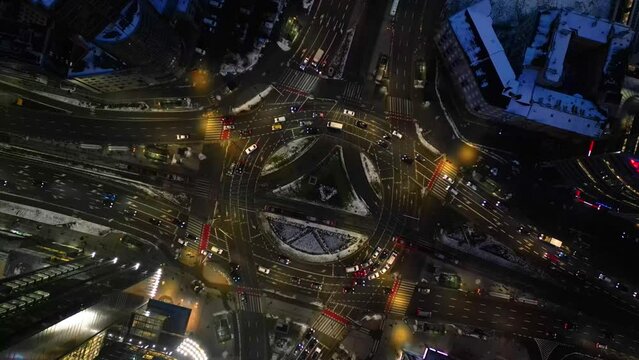 Night drone shot of Rondo ONZ (Roundabout of the UN) in Warsaw, Poland
