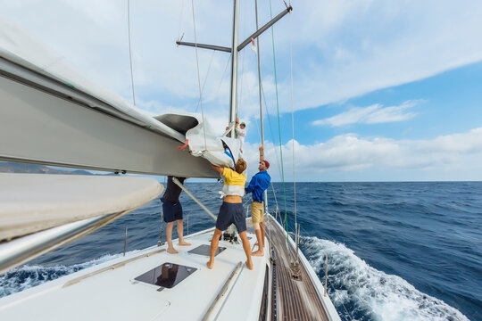 Men preparing sailing equipment