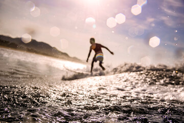 Surfer on wave,Â Sumbawa, Indonesia