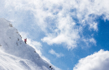 Professional Skier Michelle Parker Standing On A Ridge And Spots Her Line Before Dropping At Cerro Catedral In Argentina