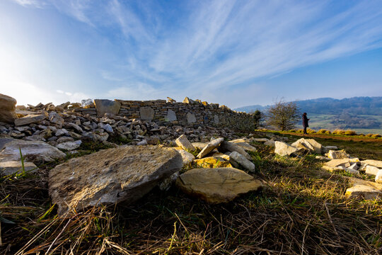 Drystone Wall And Walker In Gloucestershire, UK