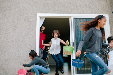 The start of the Easter egg hunt as children and teens run to hunt