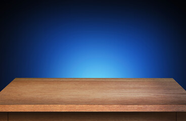 Empty wooden table for product or montage display and blue background