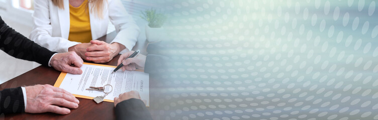 Realtor giving explanation to a couple about terms of investment contract (lorem ipsum text used); panoramic banner