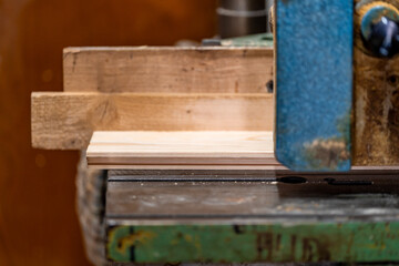 planing boards on a machine in a joinery. copy space