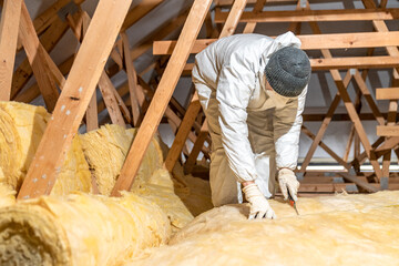 thermal insulation of roof spaces with glass wool - obrazy, fototapety, plakaty