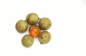 Top View of Schleichera Oleosa or Kusum Fruit Isolated on White Background with Copy Space