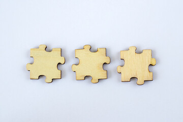 Mock up of three blank wooden puzzles on a white background for your abbreviation text or design.