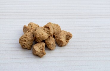 Soya Chunks Isolated on White Wooden Background with Copy Space for Texts Writing