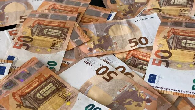 50 € banknotes lying in abundance on a table. money banknotes bill close up. High Quality 4k Cinematic footage