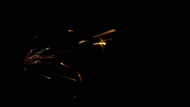 Fabulous Fiery splashes of Bengal fire. An essential attribute of a Merry Christmas. Slow motion blur and glare. The splashes fly from left to right.