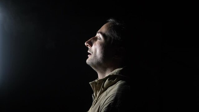 Tired man inhale cold night air