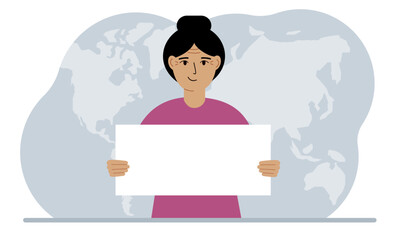 The concept of world attention. A woman holds a white poster in his hands against the background of a world map.