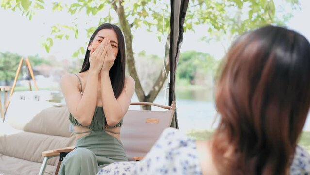 Happy Asian woman talking fun story with friends, Outdoor concept