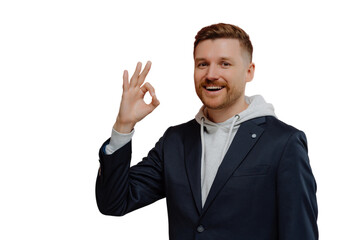 Happy redhead man showing okay gesture isolated over pink wall