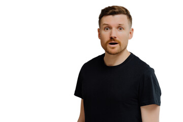 Good looking ginger man being in shock, looking at camera with amazement