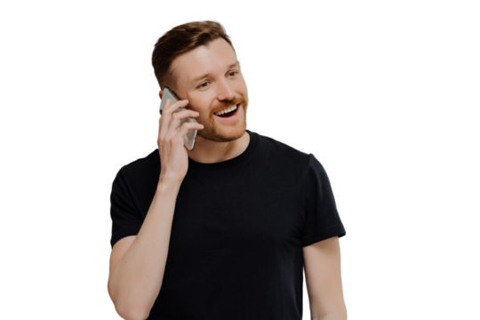 Excited man having pleasant conversation on mobile phone and feeling happy