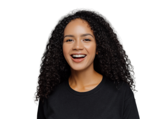 Close up shot of happy dark skinned Afro American woman laughs positively, being in good mood, dressed in black casual clothes, isolated on grey background. Human emotions and feeligs concept.