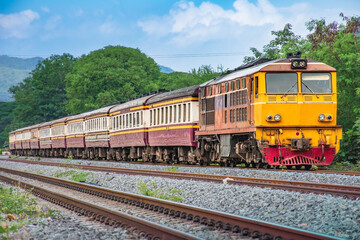 Fototapeta premium Passenger train by diesel locomotive on the railway.