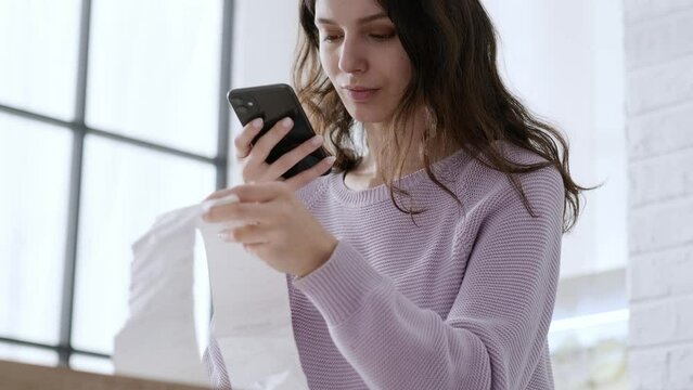 economical woman work on phone calculator at home pay bills taxes on gadget online, provident female calculate finances expenditures, manage plan family household budget on phone.