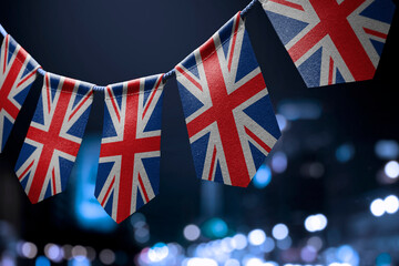 A garland of United Kingdom national flags on an abstract blurred background