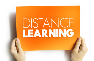 Distance learning - education of students who may not always be physically present at a school, text on card concept background