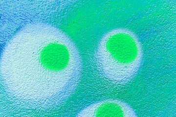 Colorful aerosol street wall background. Urban modern art texture. Wallpaper design backdrop...