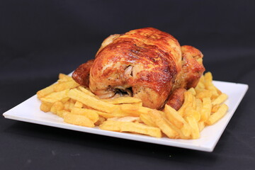 Close up of Grilled Chicken and Crunchy Chips Presented on Nice White Plate  Food Stock