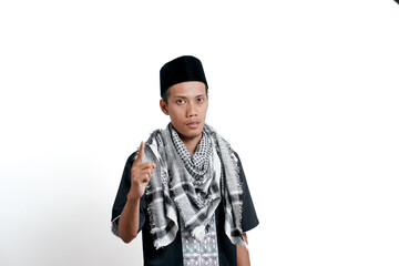 Religious muslim asian man wearing turban, muslim dress and cap. Signal number one. isolated on white background.