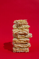 Instant noodles on red background