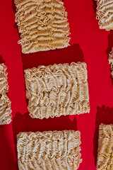 Instant noodles on red background