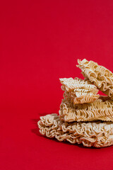 Instant noodles on red background