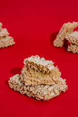 Instant noodles on red background