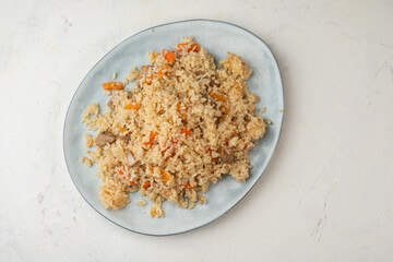 Pilaf with meat and carrots, rice with meat, top view.