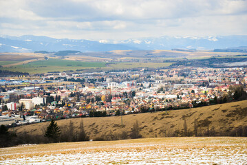 Fototapeta premium View from Haj-Nicovo to the part of Liptovsky Mikulas city in the spring and Low tatras. Slovakia, Liptov region.