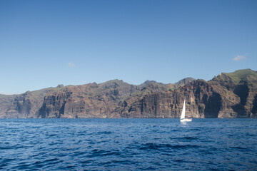 Whale and dolphin watching from a boat at Los Gigantes Cliff, Tenerife, Canary Islands. Spain