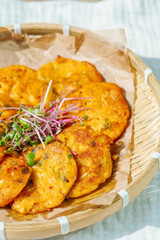 Kimchijeon, Korean Kimchi Pancake food : Slices of well-fermented kimchi mixed into a flour batter and pan- fried. Finely chopped pork, squid, and clam meat may be added to the batter as well.