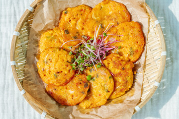 Kimchijeon, Korean Kimchi Pancake food : Slices of well-fermented kimchi mixed into a flour batter and pan- fried. Finely chopped pork, squid, and clam meat may be added to the batter as well.