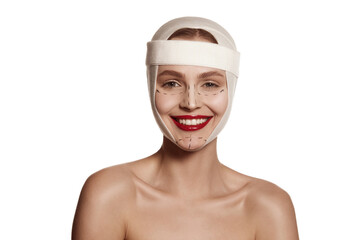 Female face bandaged with medical bandages human emotions. Making beauty, modifying face to make...