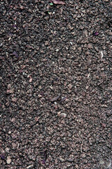 Close-up view of rough black asphalt