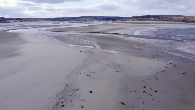 Low-flying drone shot of sea birds at Gress beach on the Outer Hebrides of Scotland.