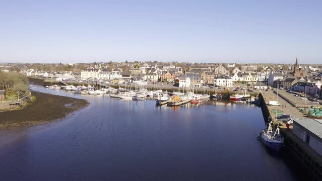 Drone shot of Stornoway Harbour on a sunny day on the Isle of Lewis, Outer Hebrides of Scotland, United Kingdom.