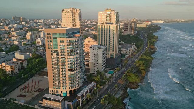 Cinematic shot with drone on the Malecon of Santo Domingo at sunset