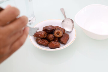 Date palm fruits on the table. Ramadan concept