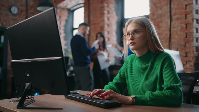Woman Tech Support Specialist Of IT-Company Working With Computer, Portrait In Loft Office