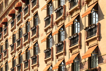 Fototapeta premium Awnings on windows of the hotel building.