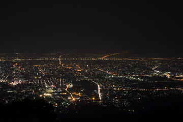 Fototapeta premium Night city scape at top view point of Chiang Mai, Thailand.